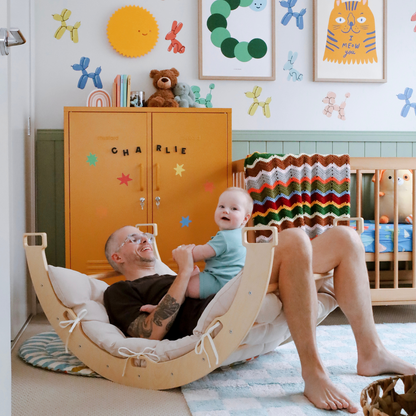 The rocking arch is large enough for both parent and child to play on together