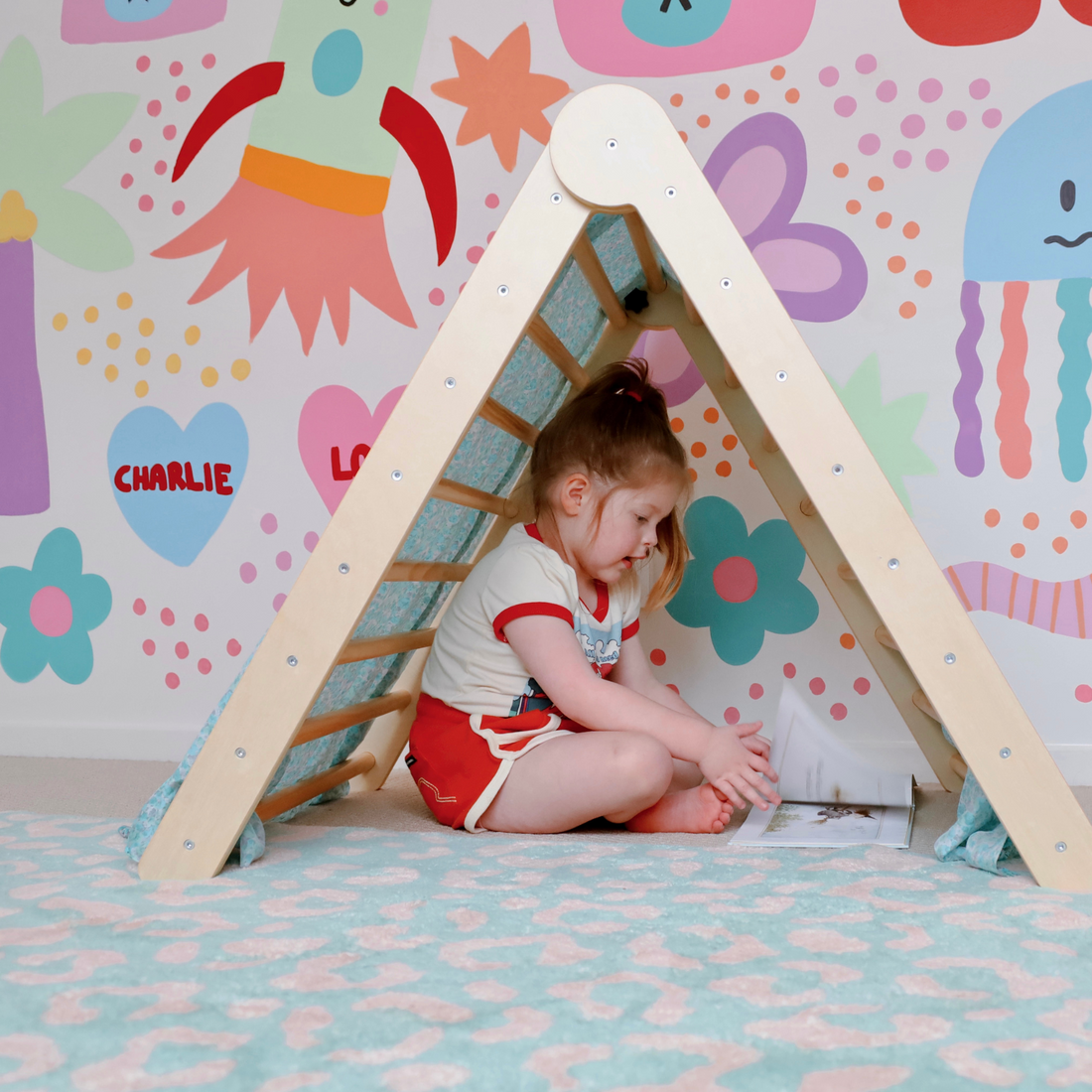 Our folding pikler triangle makes for the best cubby house